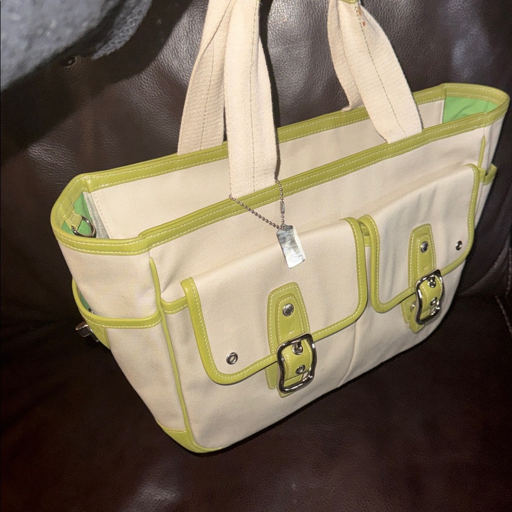Coach VTG canvas with green leather trimming and bottom silver buckles